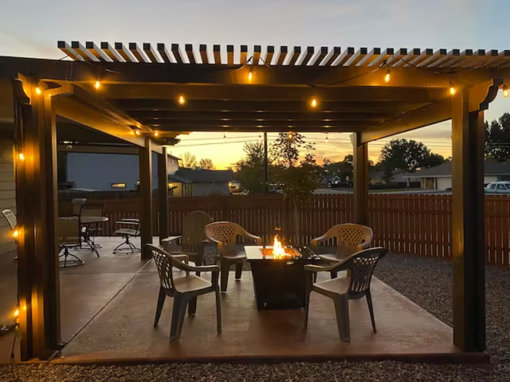 Blair Bungalow pergola with fire pit at sunset