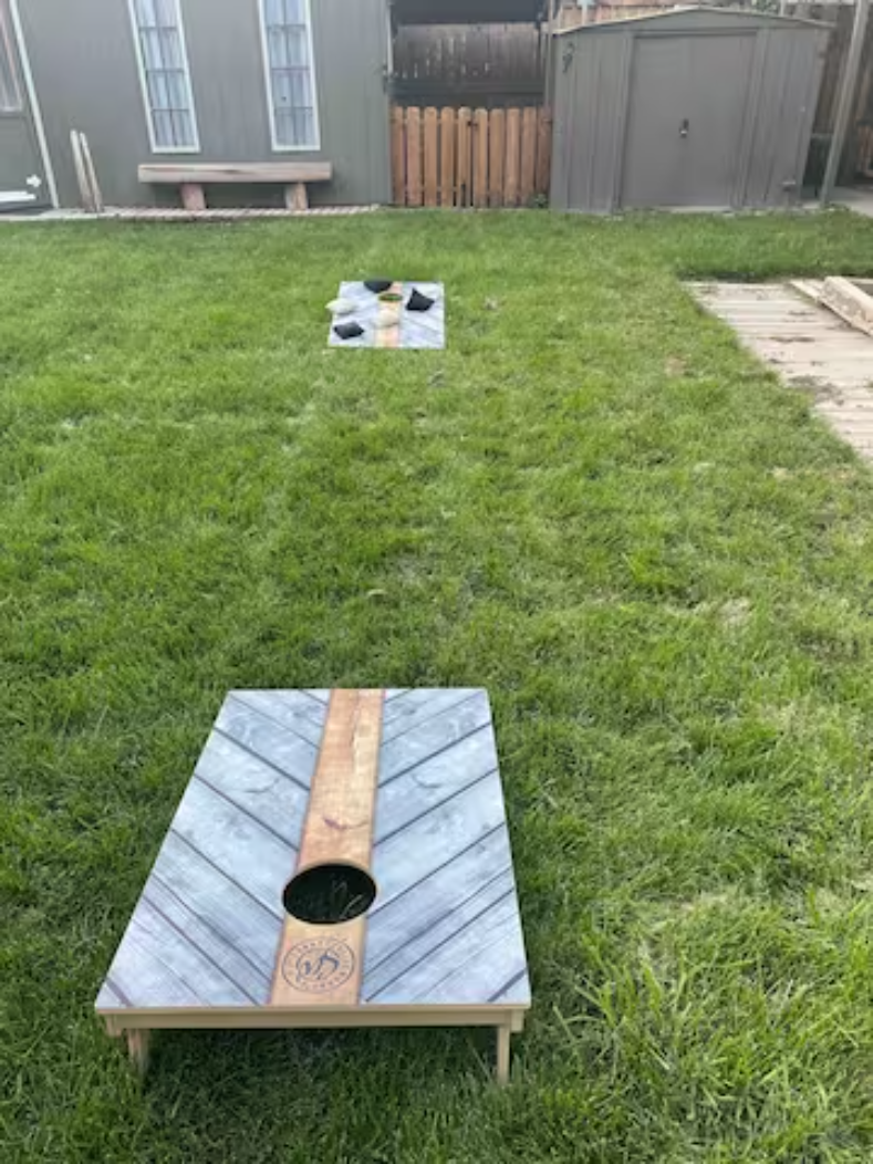 Cornhole boards in the backyard
