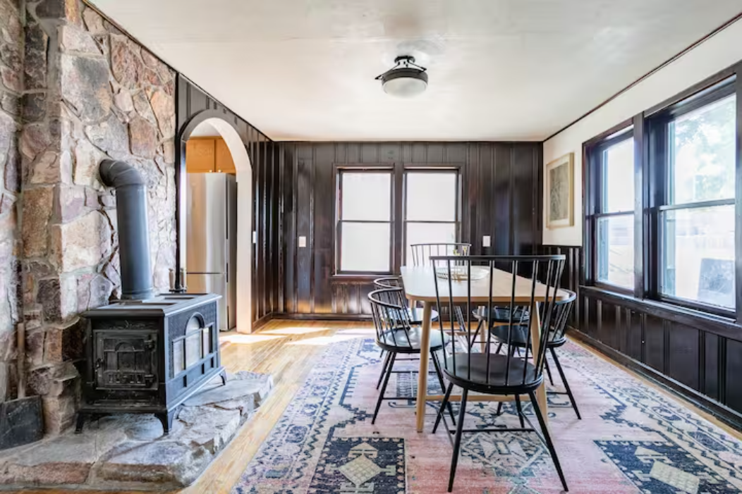 Dining room with wood-burning fireplace