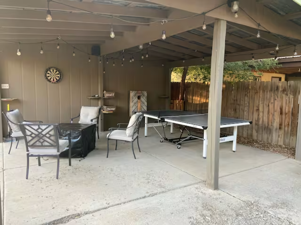 Covered pergola with ping-pong and darts